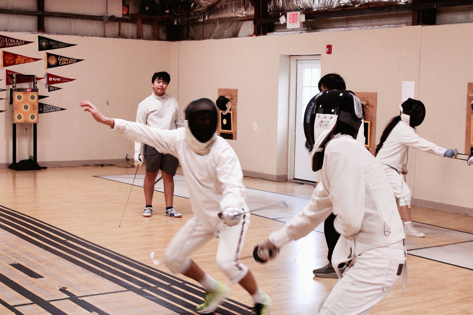 Student fencing during summer camp activity